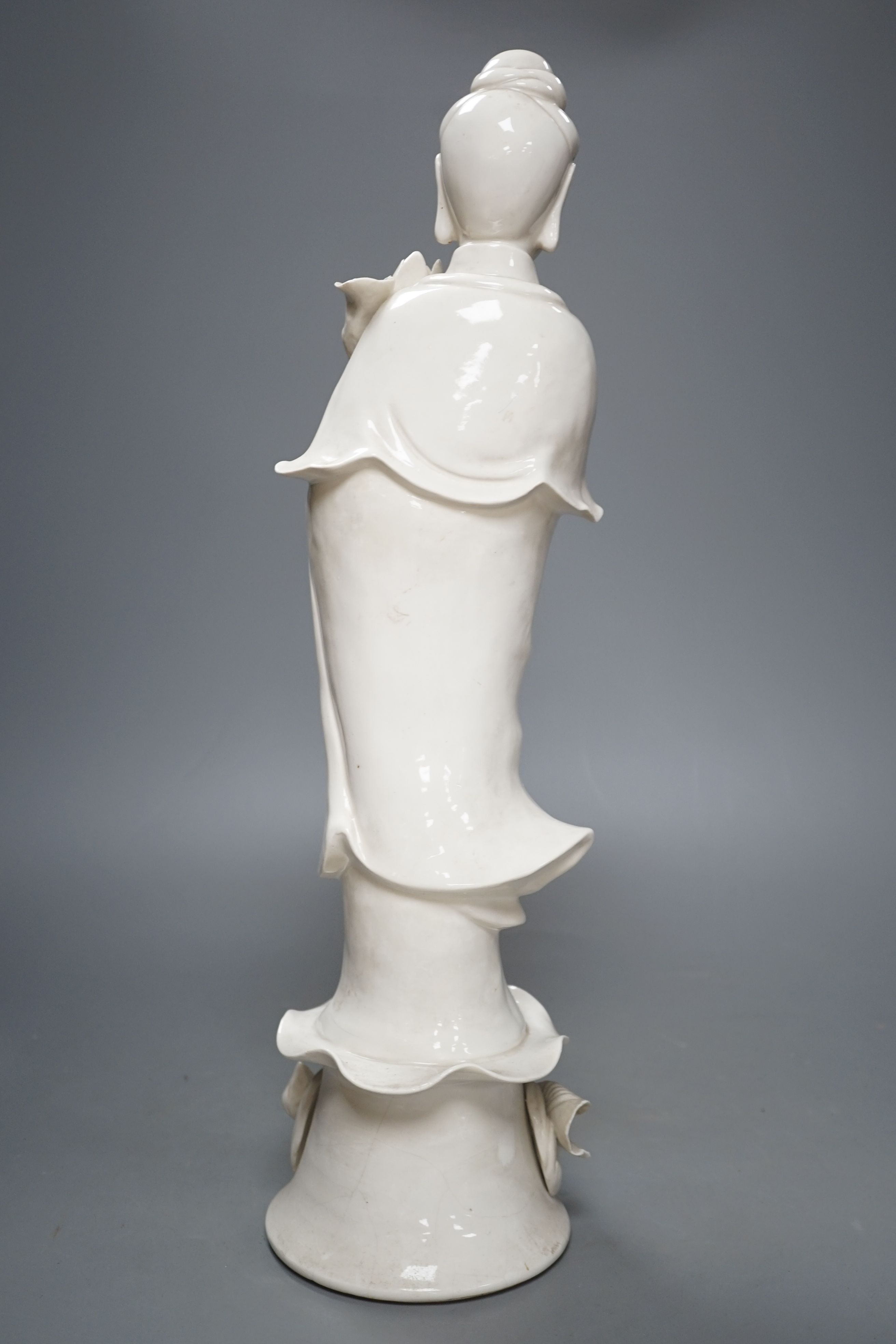 A tall Chinese blanc de chine figure of Guanyin -47cm high